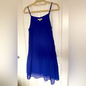 Ultramarine blue dress with pleats.